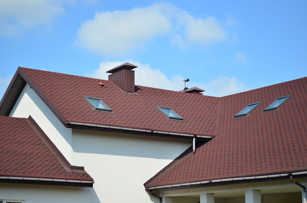 Roofing experts at work in Covington, LA, by Relax Roofing.