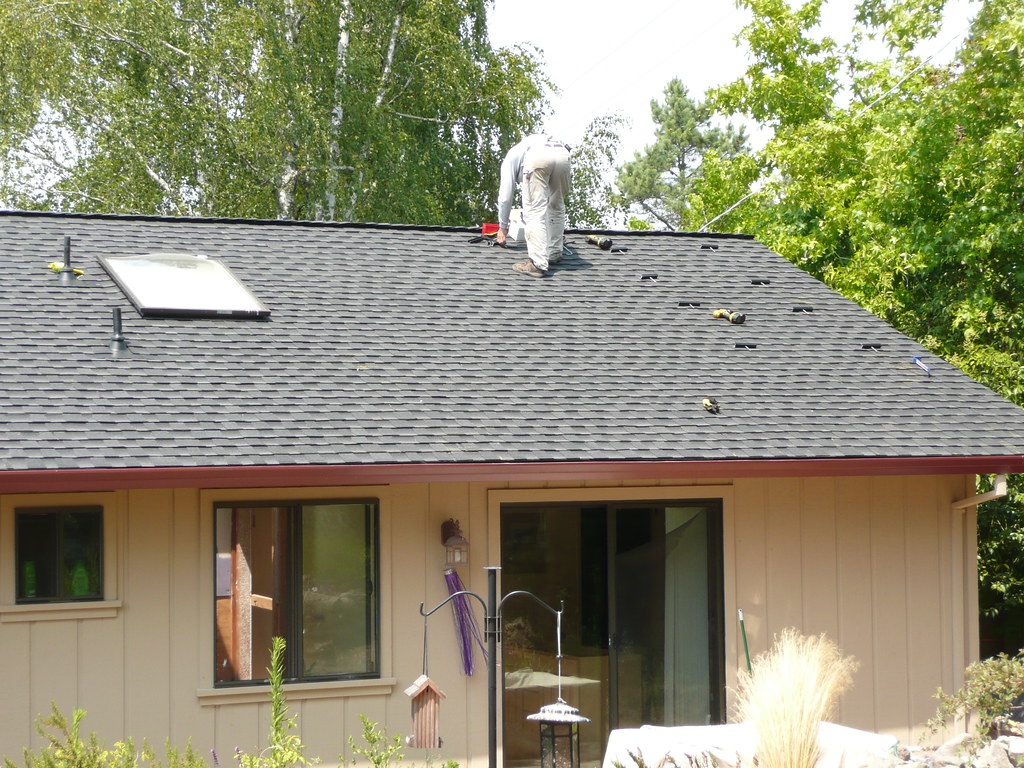 Professional roofing team at work in Abita Springs, LA by Relax Roofing.